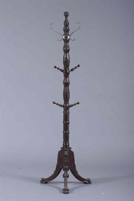 Appraisal: VICTORIAN CARVED MAHOGANY POLE-STYLE COAT RACK Turned foliate-carved support turned