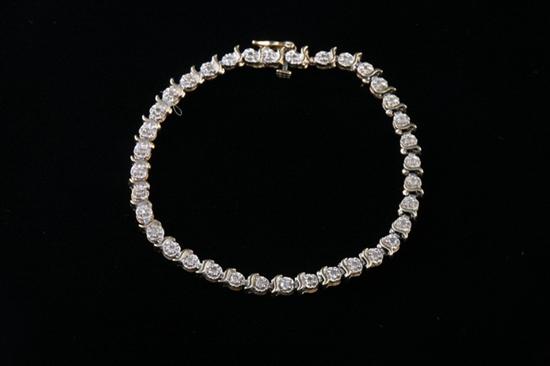 Appraisal: K YELLOW GOLD AND DIAMOND TENNIS STYLE FLEXIBLE LINK BRACELET