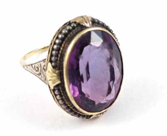 Appraisal: AMETHYST AND TEN KARAT GOLD SOLITAIRE RING with a bezel