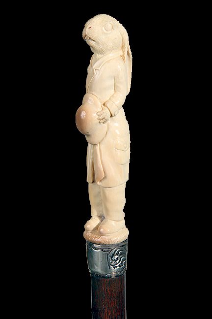 Appraisal: Mammoth Ivory Dress Cane th Century- a dandy carved rabbit