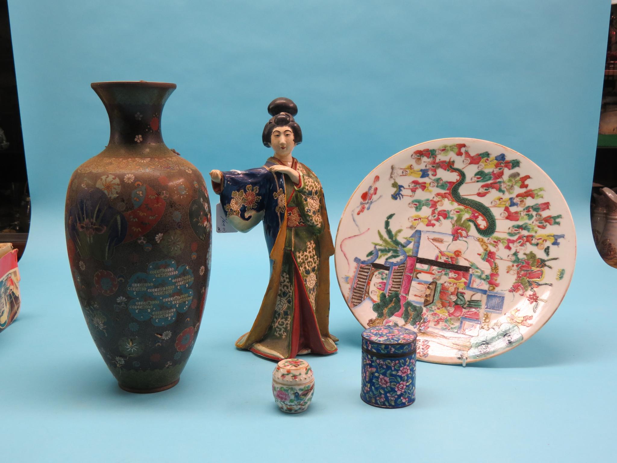 Appraisal: A Japanese earthenware figure of a lady wearing brightly-painted full-length