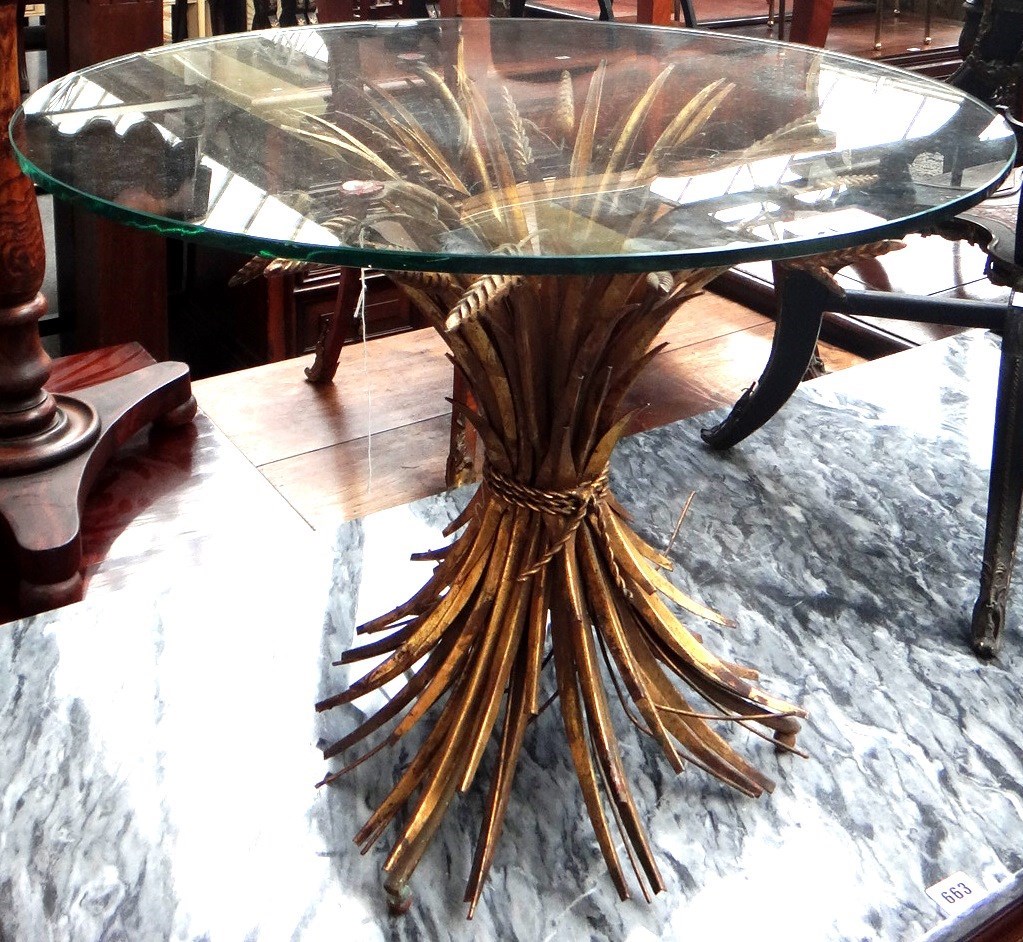 Appraisal: A th century occasional table the circular glass top on