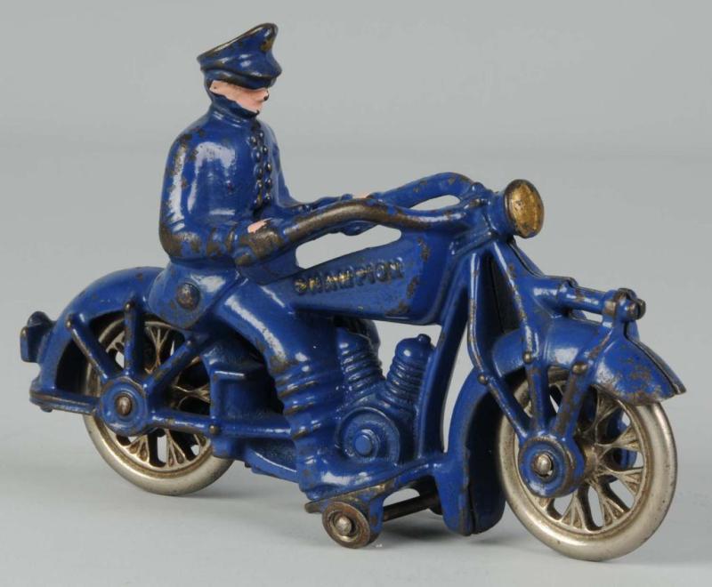 Appraisal: Cast Iron Champion Motorcycle Toy Description Better variation with nickel-spoked