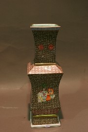 Appraisal: A facetted famille rose vase each side with a scene