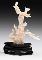 Appraisal: Chinese white coral carving of Quanyin Enhanced from natural form