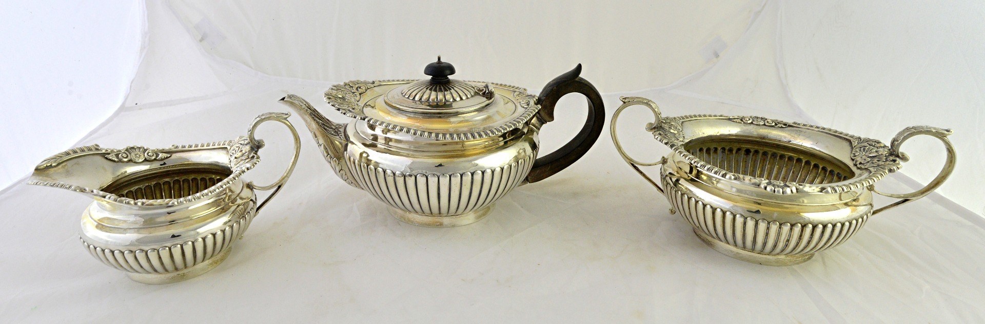 Appraisal: A silver three piece tea set comprising a teapot a