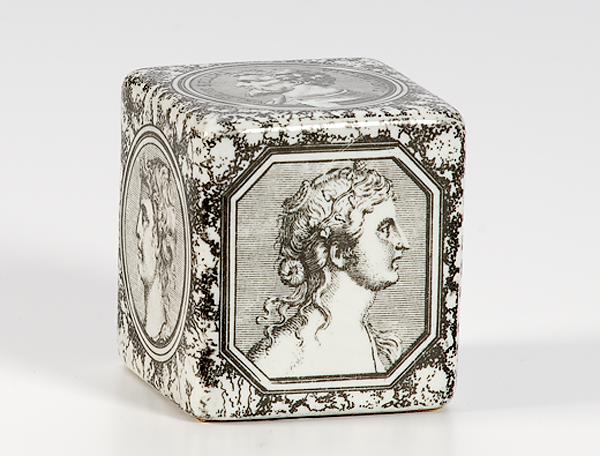 Appraisal: FORNASETTI PORCELAIN CUBED PAPERWEIGHT Italian th century cubed porcelain paperweight