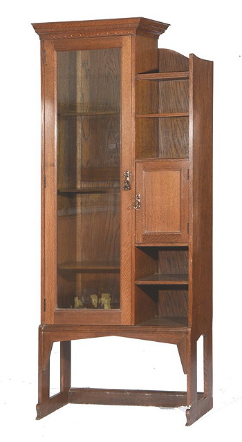 Appraisal: A SHAPLAND AND PETTER TALL OAK BOOKCASE with glazed cupboard