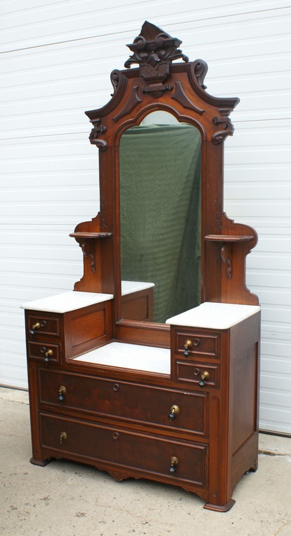 Appraisal: Walnut Victorian drop center vanity with white marble tops carved