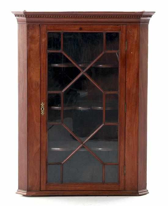 Appraisal: Regency mahogany hanging corner cupboard early th century dentil-molded cornice