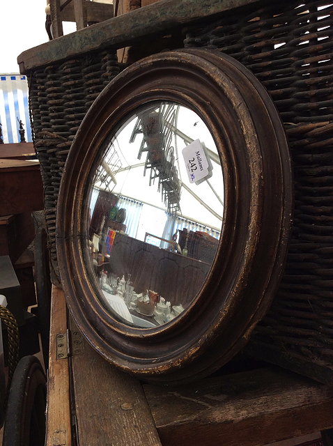 Appraisal: AN EARLY TH CENTURY CONVEX WALL MIRROR and a collection