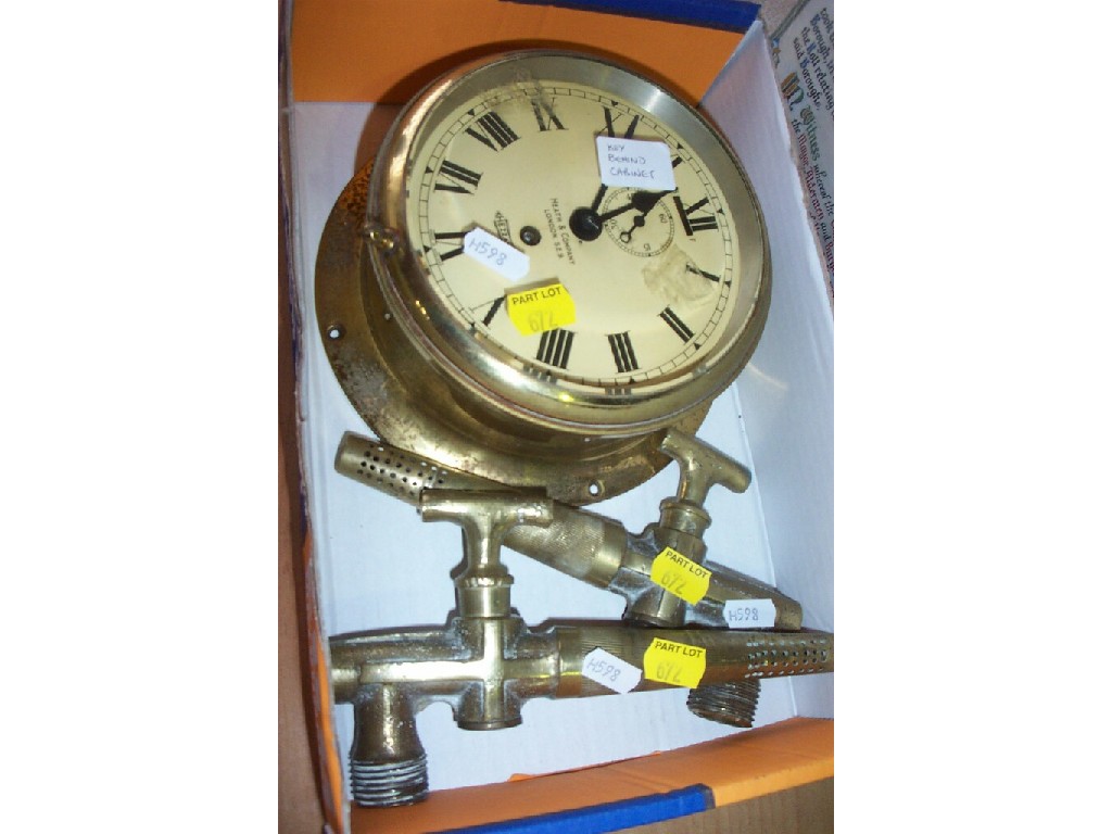 Appraisal: A brass cased ships clock inscribed Hezzanith to dial by