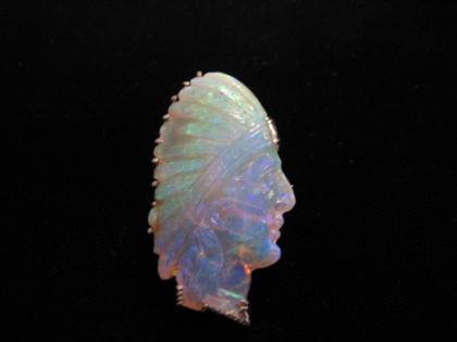 Appraisal: Whimsical carved white opal brooch Platinum set carved white opal