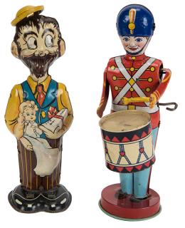 Appraisal: Pair of Tin Litho Wind-Up Figural Toys Lithographed tin figures