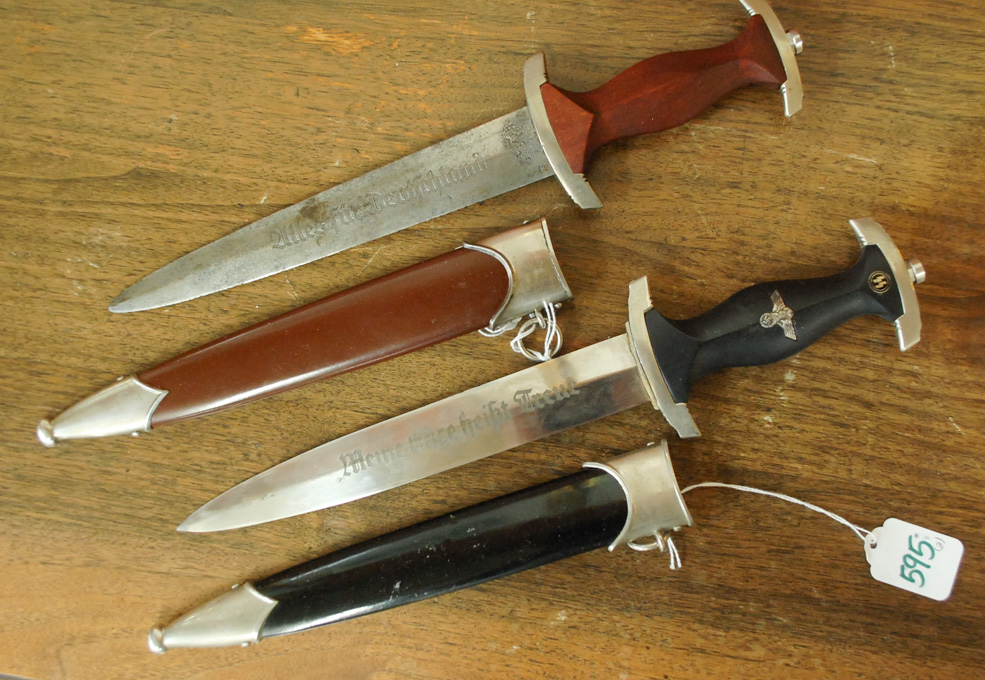 Appraisal: TWO GERMAN WW STYLE DAGGERS the first after the SS