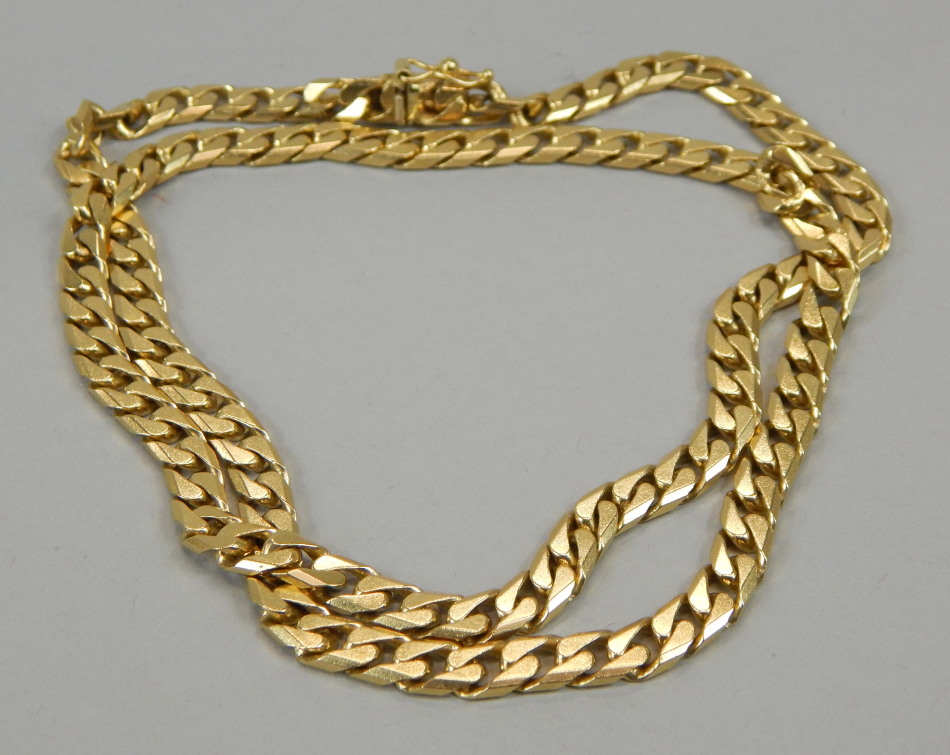 Appraisal: A curb link chain yellow metal stamped g all in