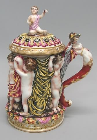 Appraisal: Figural nude handle and six putti type figures among drapes