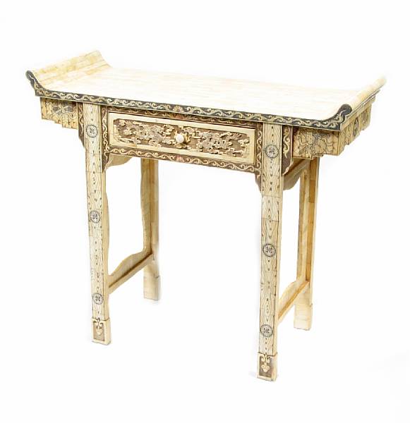 Appraisal: A Chinese carved and pieced bone altar table height in