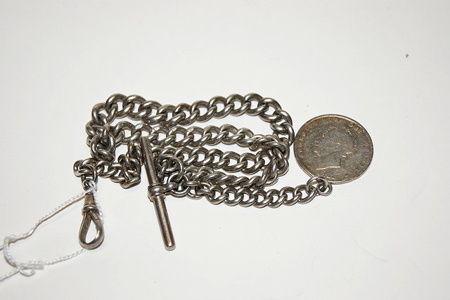 Appraisal: A SILVER GRADUATED WATCH CHAIN of link form with coin