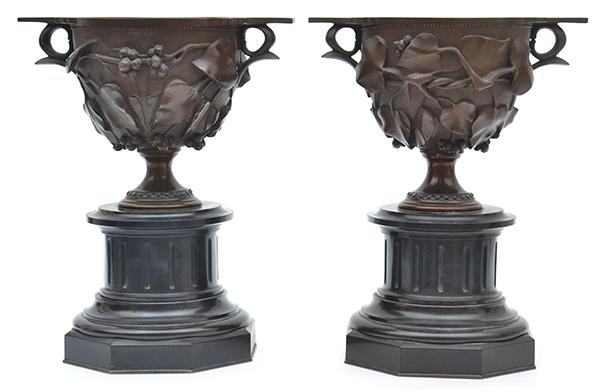 Appraisal: A PAIR OF BRONZE AND SLATE URNS ON ALABASTER STANDS