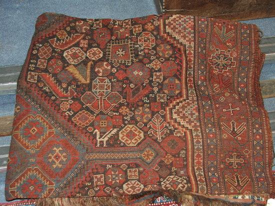 Appraisal: AN OLD SHIRAZ HALL CARPET with triple medallion centre and