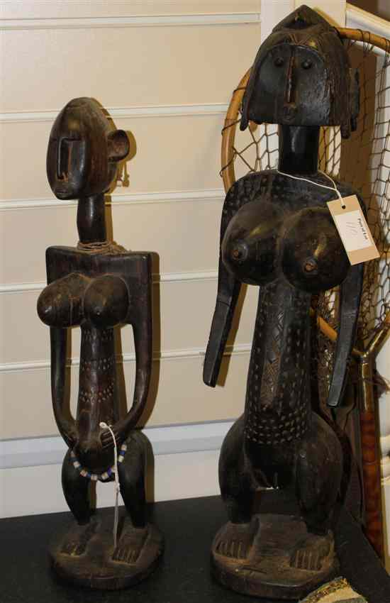 Appraisal: Two African dogon style figures largest ins Estimate - Descriptions