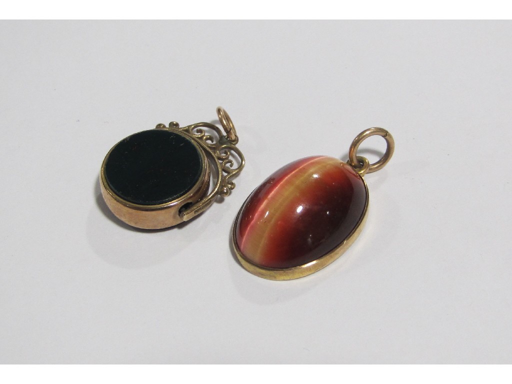 Appraisal: Lot comprising tigers eye pendant mounted in ct gold and