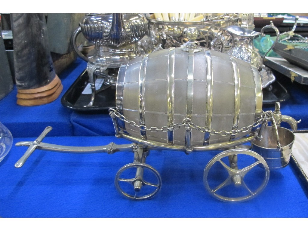 Appraisal: A silver plate and opalescent glass sherry cask on wagon