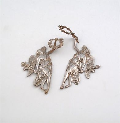 Appraisal: A pair of unmarked silver mounts modelled as angels both