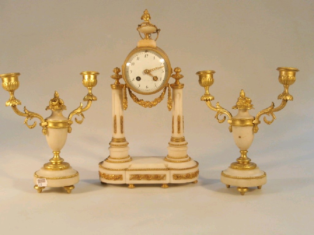 Appraisal: A late thC French gilt metal and alabaster clock garniture