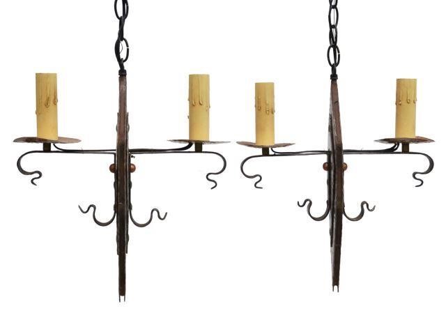 Appraisal: pair Continental wrought iron two-light chandeliers th c having pointed