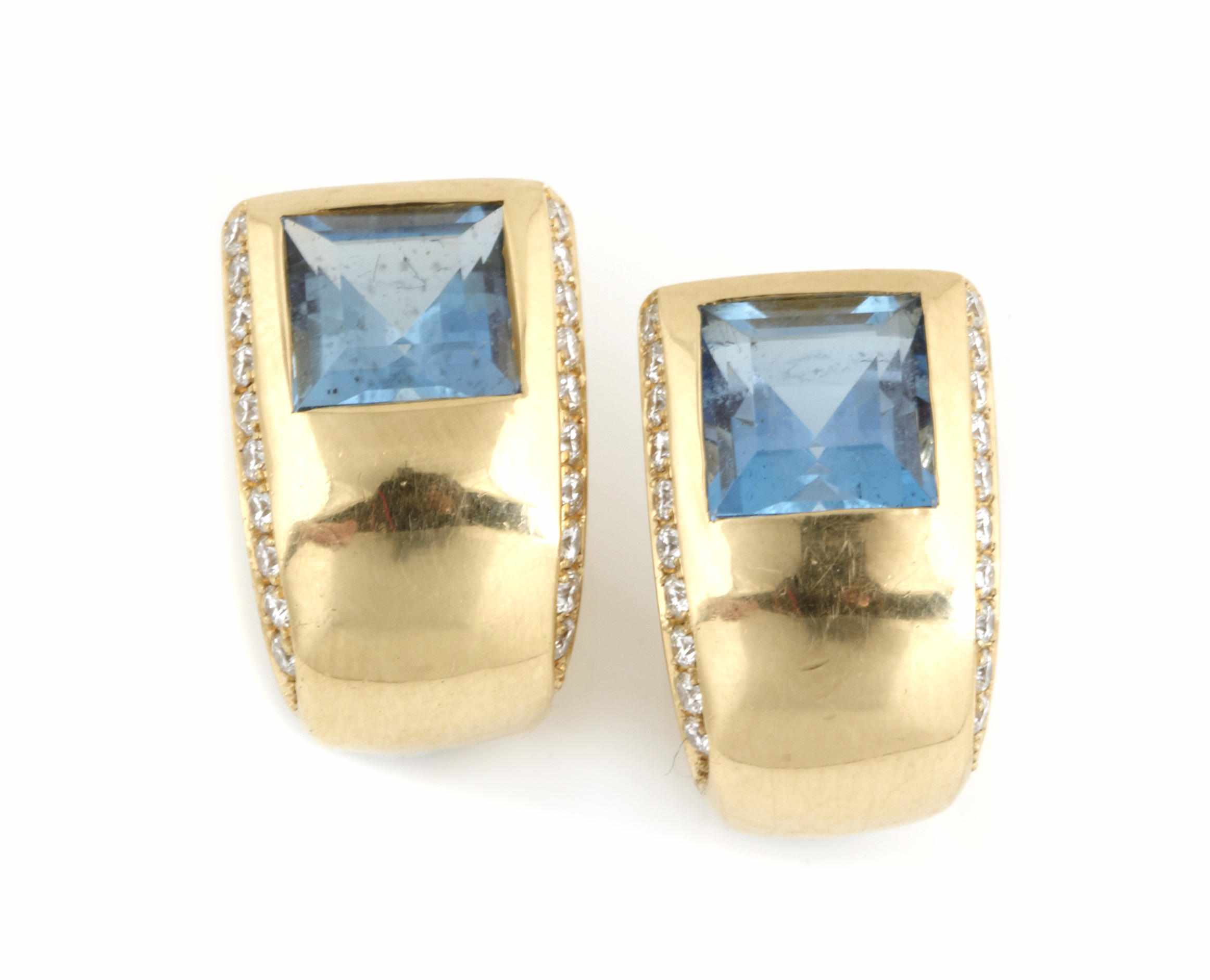 Appraisal: A pair of topaz and diamond earclips mounted in k