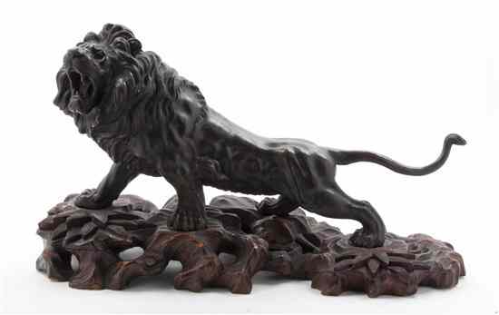 Appraisal: A Japanese Bronze Figure of a Lion depicted in stride