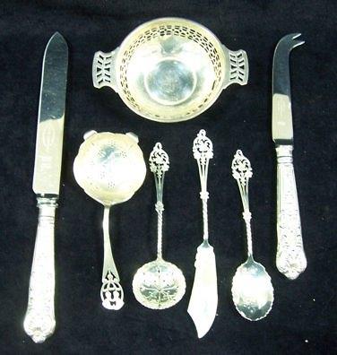 Appraisal: A sifter spoon spoon and butter knife with pierced floral