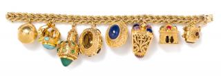 Appraisal: A Yellow Gold Charm Bracelet with Eight Attached Charms dwts