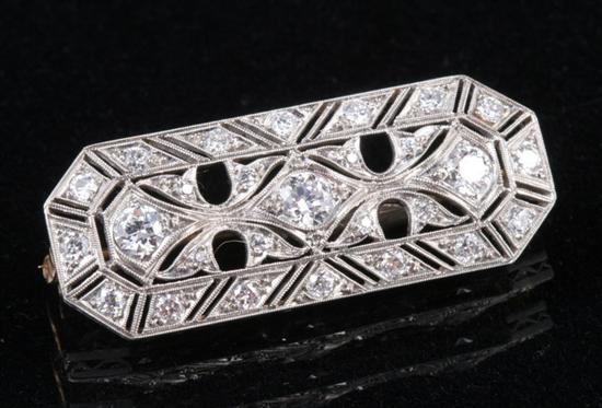 Appraisal: EDWARDIAN PLATINUM AND DIAMOND PIN Rectangular panel with canted corners