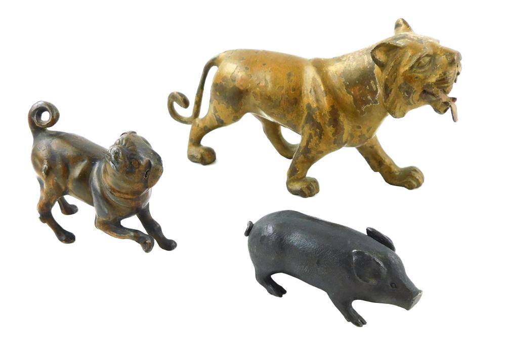 Appraisal: Three cast metal animals a small pig a pug or