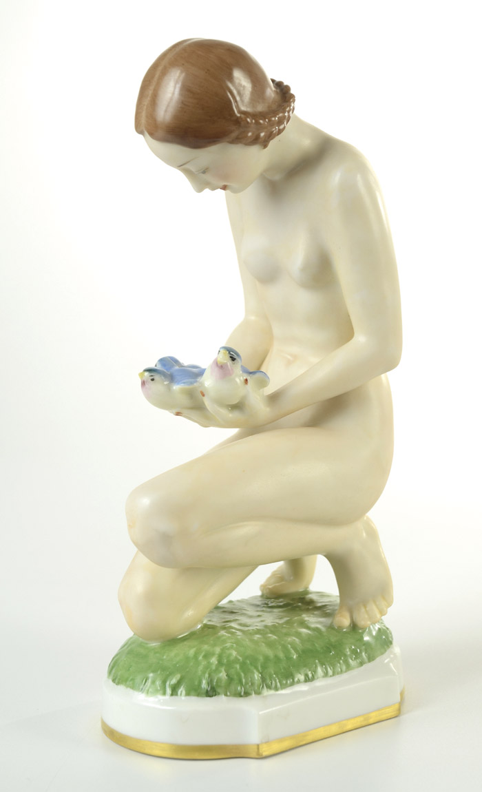 Appraisal: HUTSCHENREUTHER PORCELAIN FIGURINE of a nude female kneeling with blue