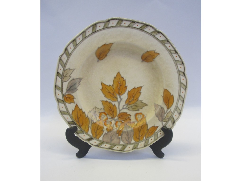 Appraisal: Charlotte Rhead plate decorated with leaves in oranges and browns