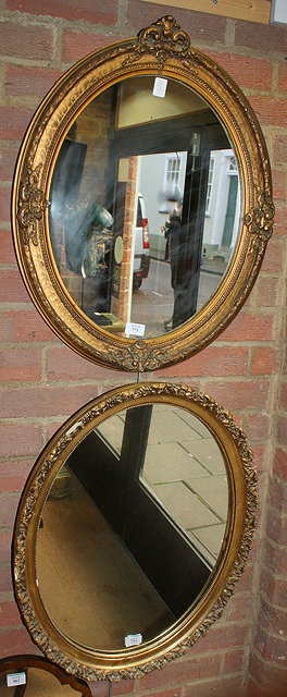 Appraisal: AN OVAL HANGING WALL MIRROR in gilt frame x cms