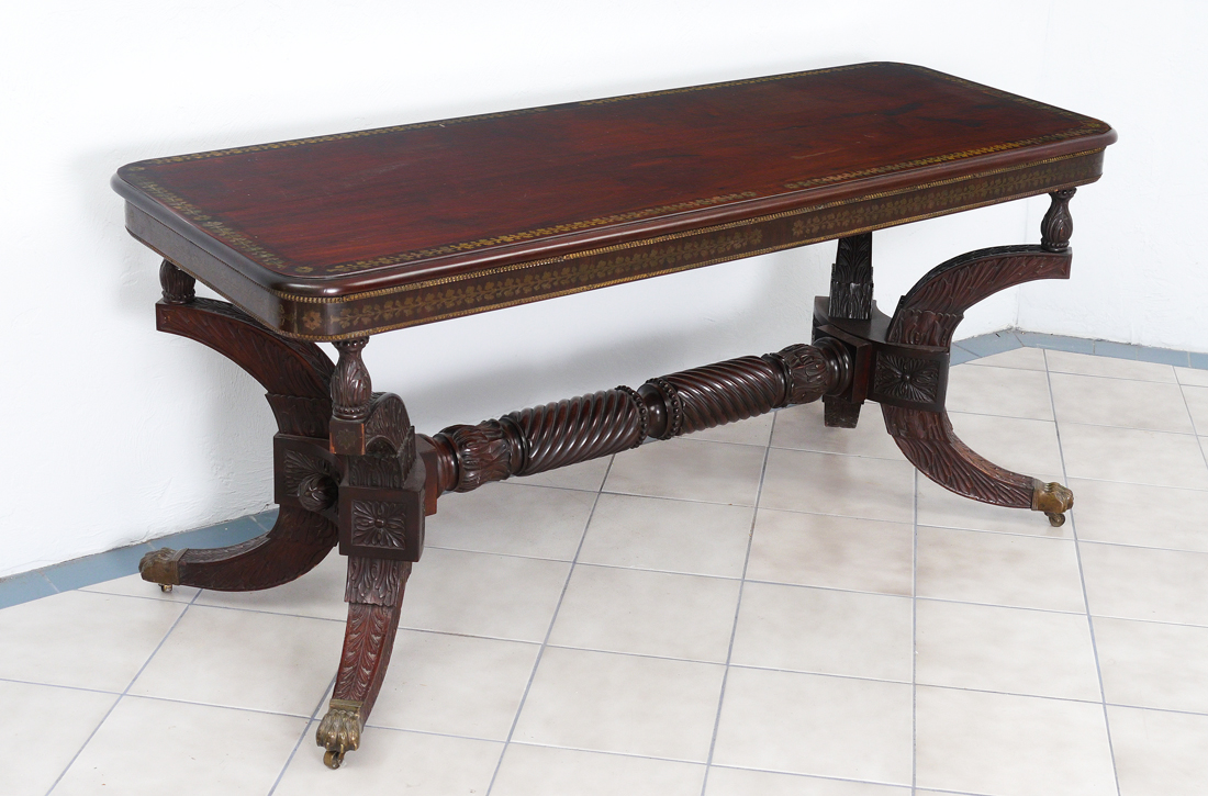 Appraisal: CARVED AND BRASS INLAID LIBRARY TABLE Wonderfully carved splay leg