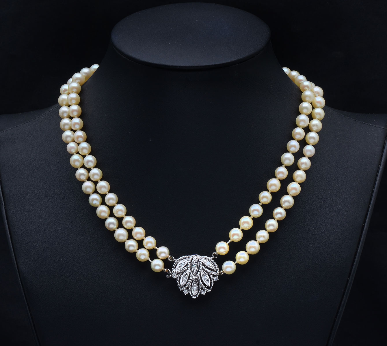 Appraisal: DOUBLE STRAND CULTURED PEARL NECKLACE WITH GOLD CLASP strand mm