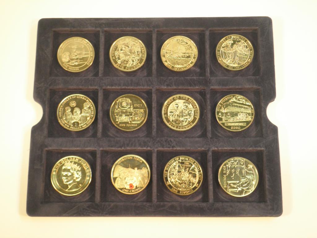 Appraisal: Twelve Queen Elizabeth II commemorative five pound coins in a