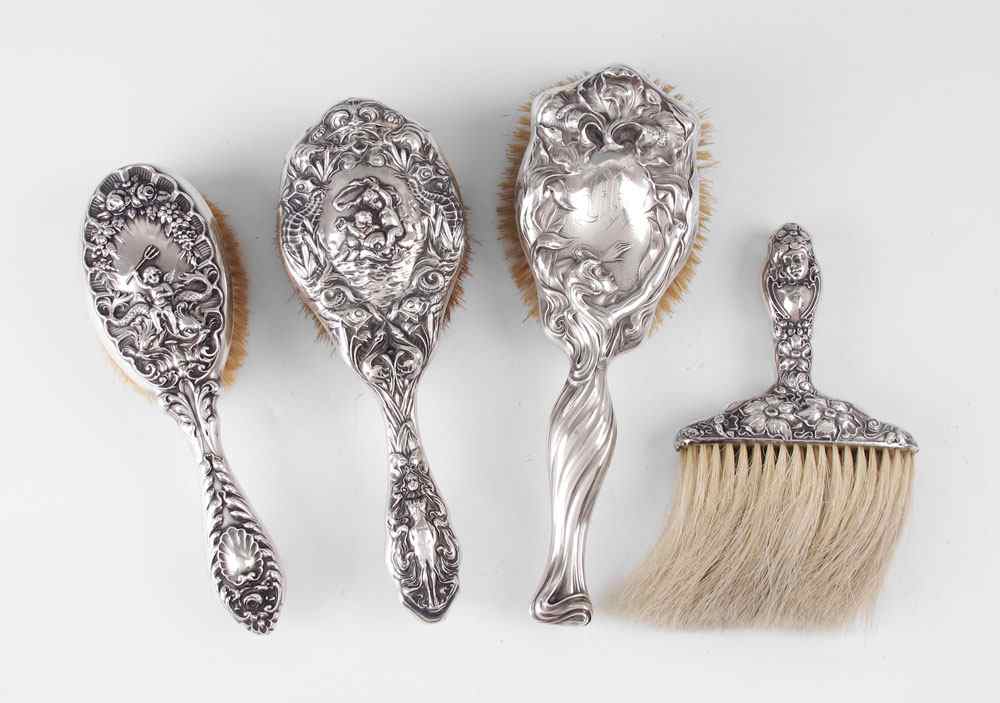 Appraisal: COLLECTION OF STERLING MOUNTED HAIR BRUSHES To include Unger Brothers