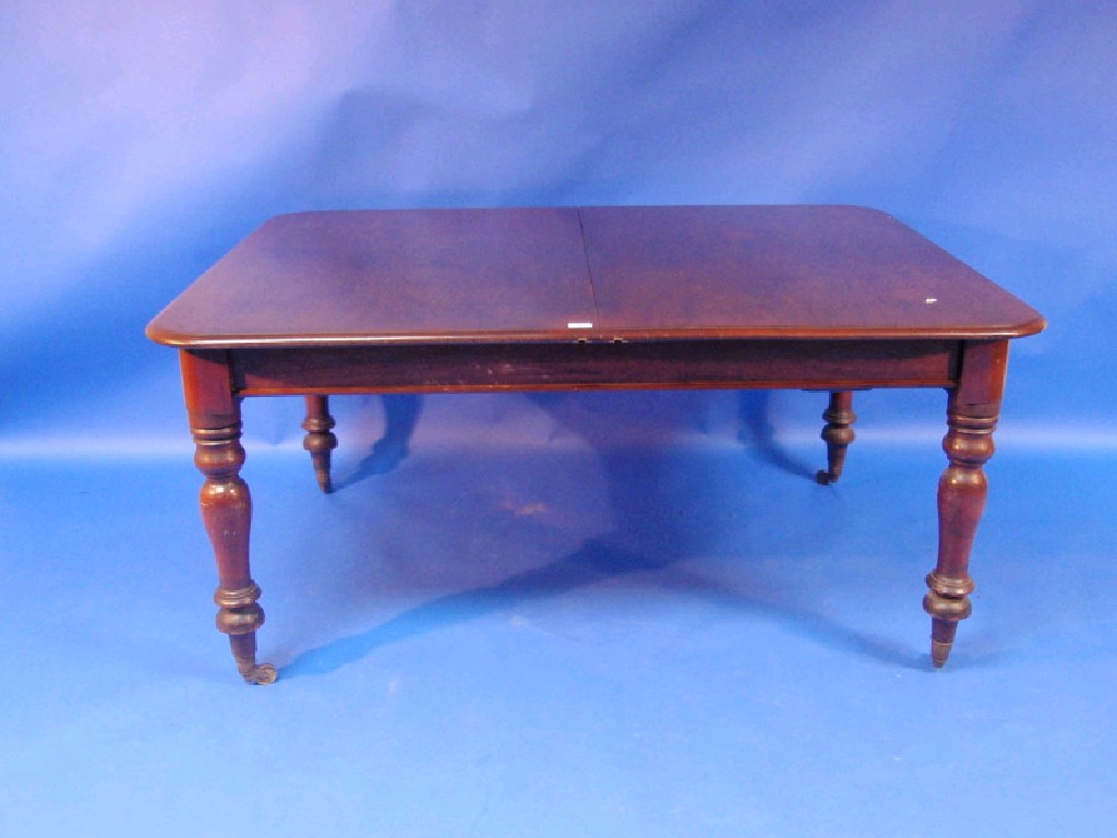 Appraisal: A Victorian mahogany extending dining table the rectangular top with