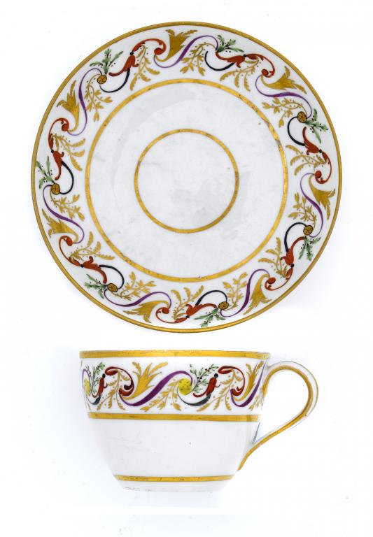 Appraisal: A PINXTON TEACUP AND SAUCER PATTERN enamelled and gilt with