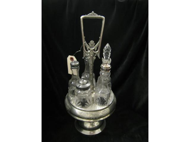 Appraisal: Victorian Silverplate Castor Set five bottles in rotating holder tall