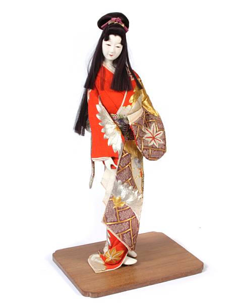 Appraisal: A group of two Japanese porcelain faced dolls with traditional