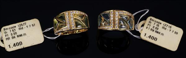 Appraisal: A pair of gem set and diamond rings set with