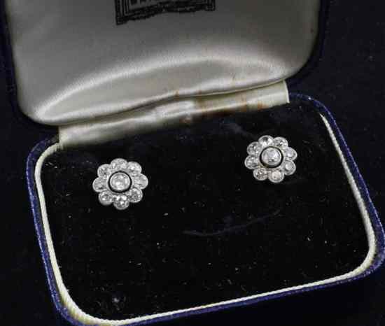 Appraisal: A pair of 's gold mounted diamond cluster ear studs